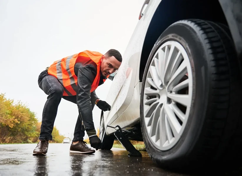 Emergency mobile tyre fitting service by TyreFlow, assisting a stranded driver day or night.